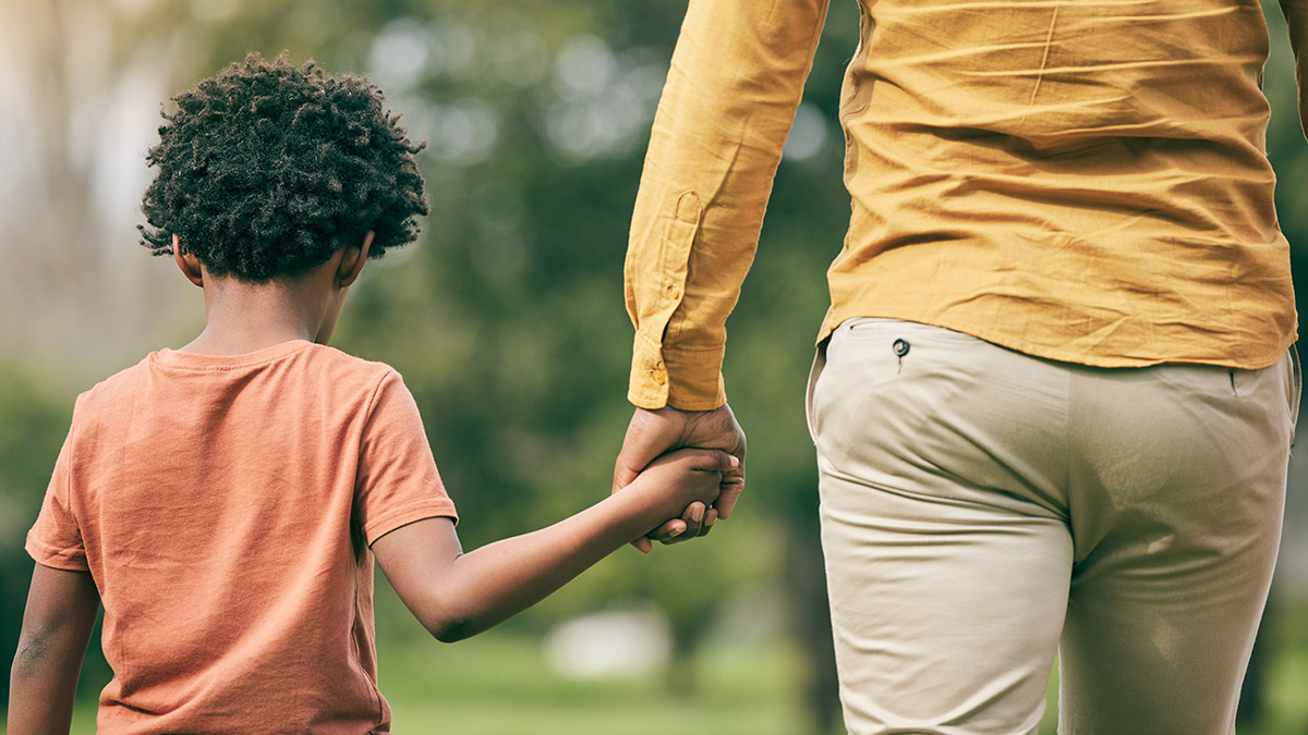 Child holding parent's hand